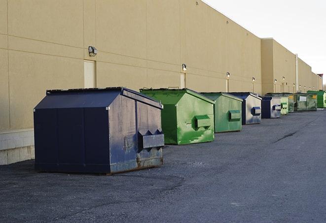 construction dumpsters on a worksite surrounded by caution tape in Fairview Heights